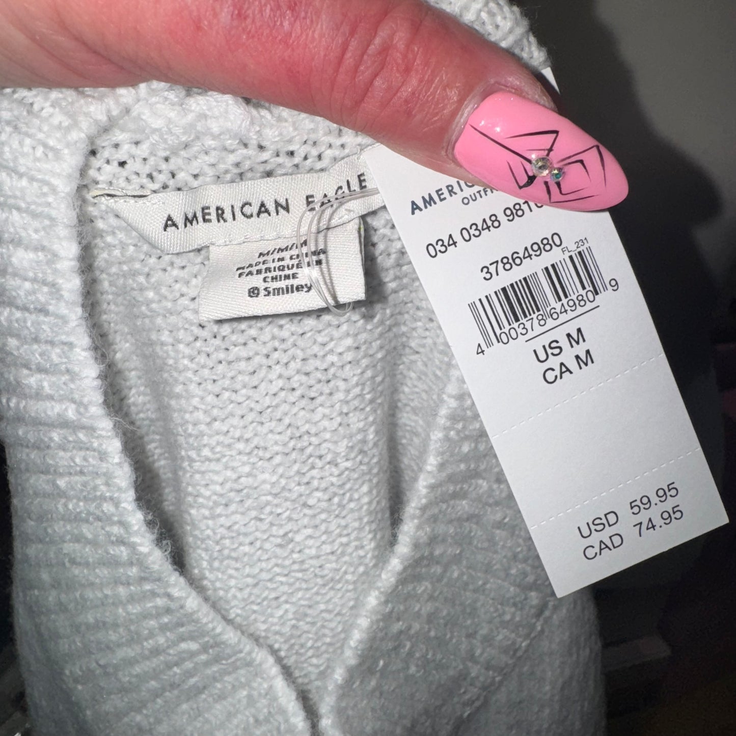 Smiley mock neck sweater